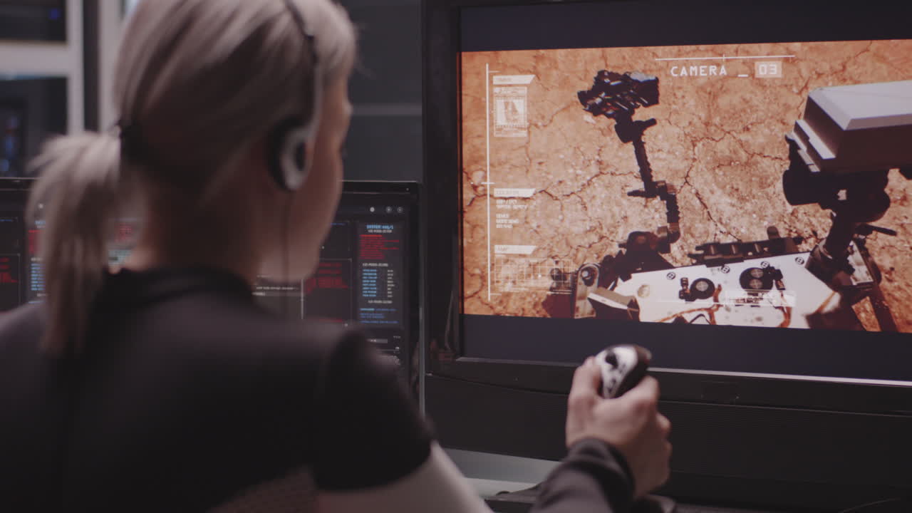 Woman Controlling a Mars Rover Simulation