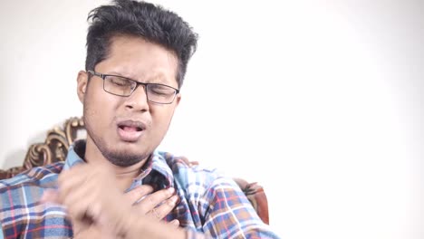 man coughing