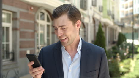 man typing message outdoor