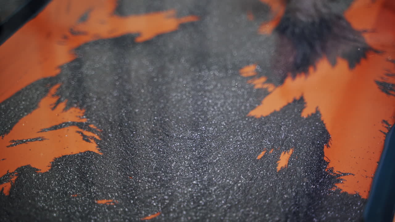 A boy plays at with Iron shavings and magnet at science activity centre. Science museum