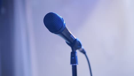 microphone standing on a scene. microphone on the rack in the concert stage