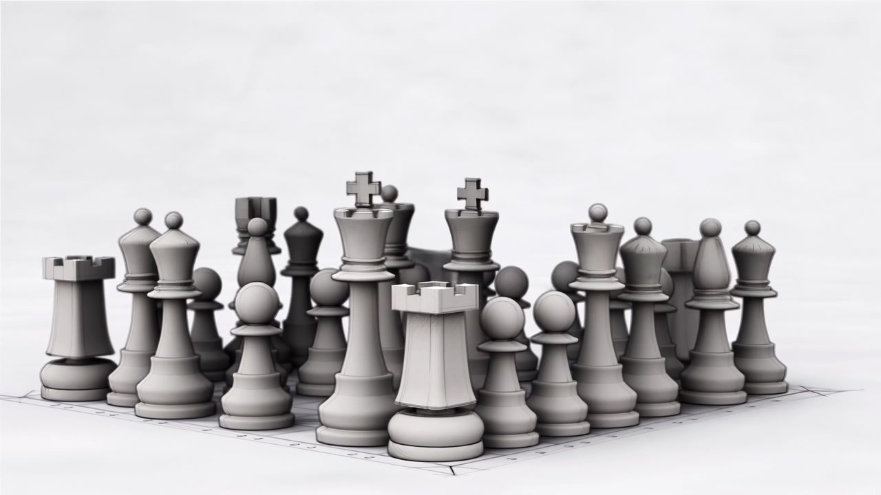 Low-angle close-up showing translucent glass chess pieces arranged on paper-drawn chessboard with mock architectural blocks behind central ranks, highlighting pawns, rooks, and crowned pieces in