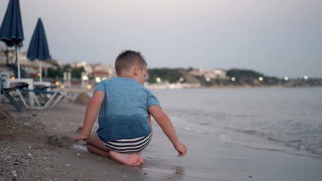 child playing at the beach summer vacation