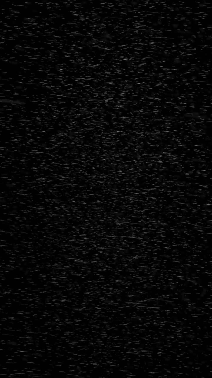 Falling Rain or Snow Particles on Black Background