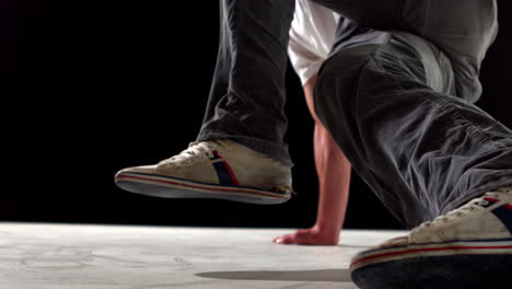 Cool-young-break-dancer-dancing-on-black-background