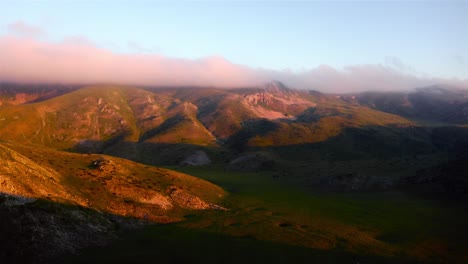 High-green-mountains-of-Mavrovo-national-park-illuminated-by-the-setting-sun-in-North-Macedonia