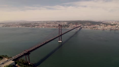 busy two ways traffics on ponte 25 de abril bridge connecting lisbon and almada over tagus river