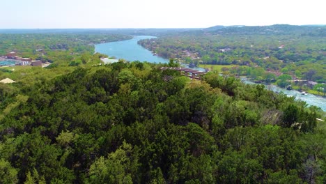 drone footage panning up at covert park on mount bonnell
