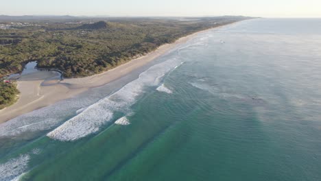 coolum beach and stumers creek on a cold morning with sea mist