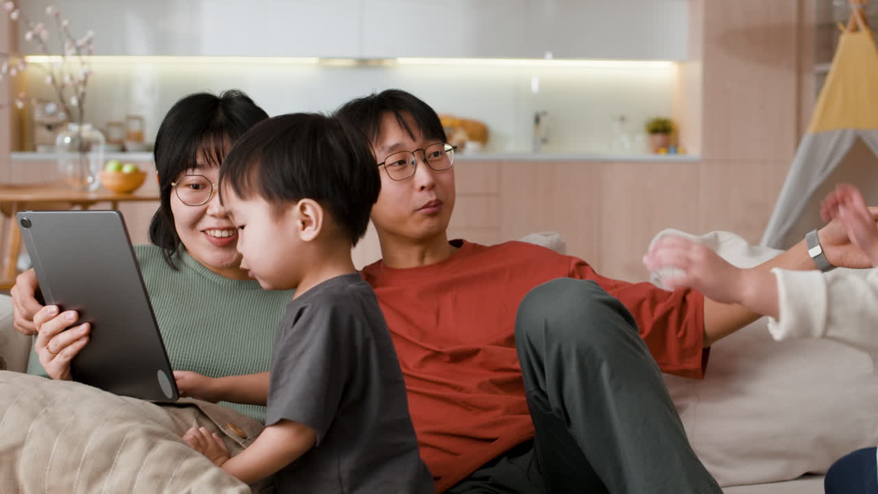 Happy Family Watching a Tablet