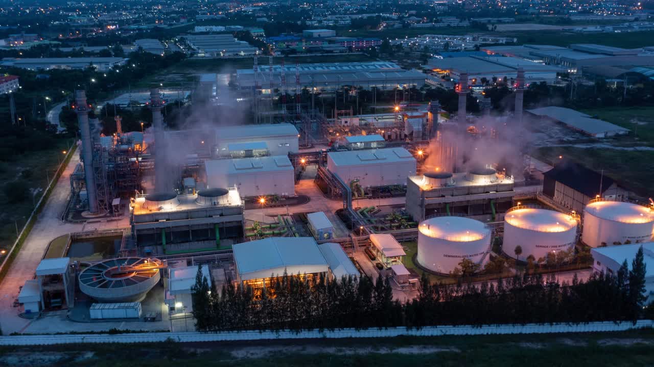 Aerial hyperlapse timelapse of powerplant or fuel gas powerplant at night