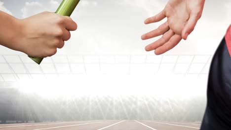Animation of athlete&#039;s hands passing relay baton over sports stadium