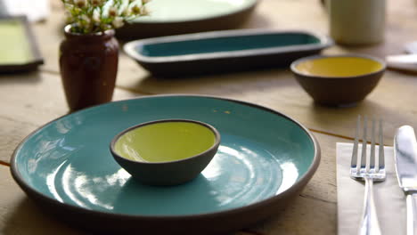 handmade earthenware on restaurant table, camera slider shot