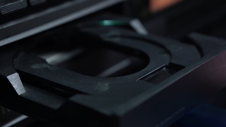 Loading CD with Rainbow Colors and Starting Music Playback in Compact Disc Player, Close Up