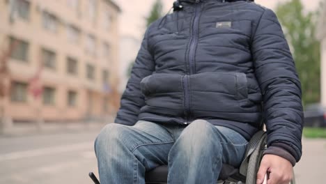 person with a physical disability waiting for city transport with an accessible ramp