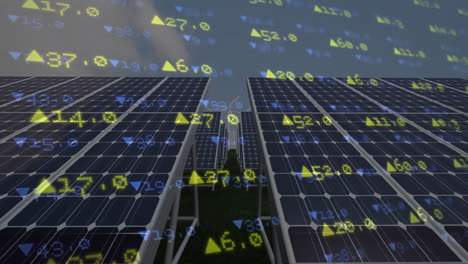 paneles solares y turbina eólica con animación de datos financieros superpuesta