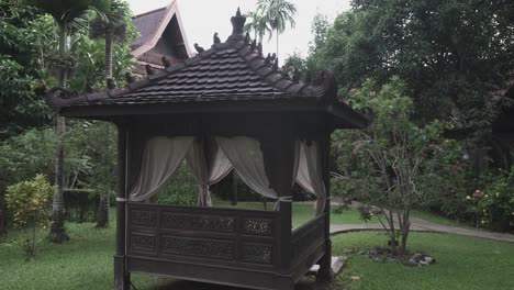 traditional wooden thai pavilion, designed for people to sit, relax and escape the heat, botanical garden, thailand