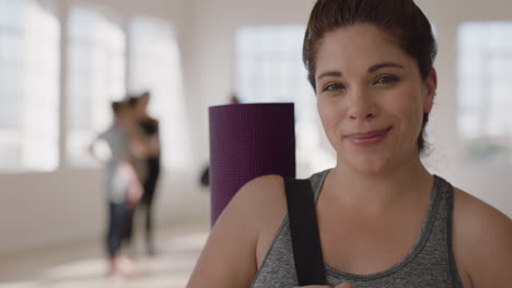 portrait beautiful caucasian woman smiling enjoying yoga class practicing healthy lifestyle in fitness studio