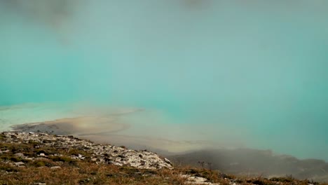 aqua marine blue super heated volcanic pools at the grand prismatic hot springs in yellowstone national park