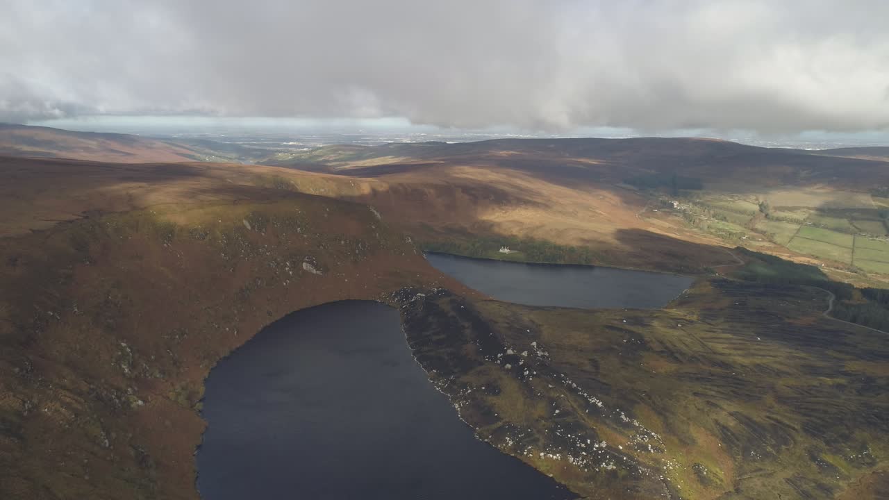 Aerial of legendary epic landscape with two lakes and cloudy thrilling horizont at Mullaghcleevaun ireland