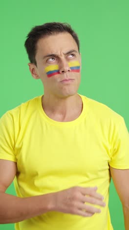 Man listening to the Colombia national anthem with solemnity