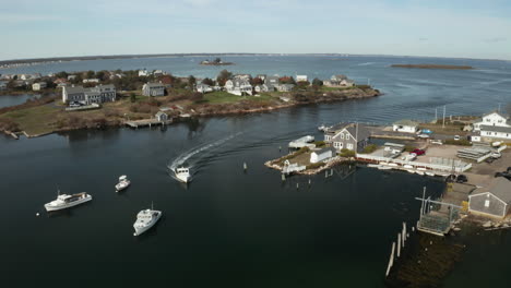 aerial panorama of boat returning to northeastern quiet coastal town