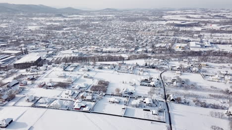 drone flight over city in poland during winter sunny day