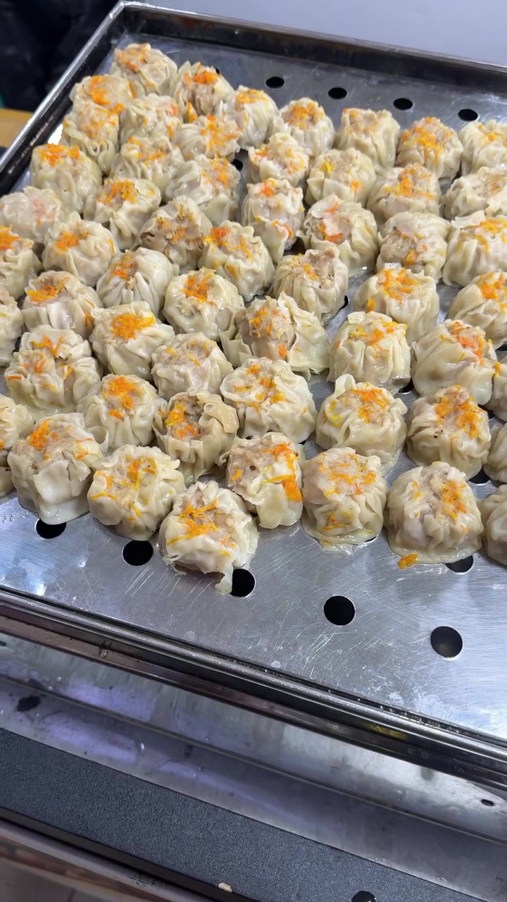 Freshly Steamed Shumai Dumplings on a Metal Tray