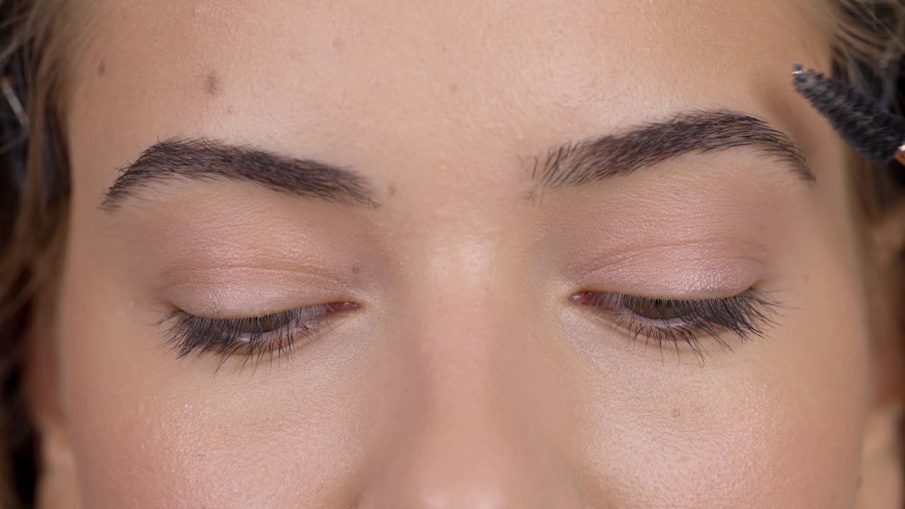 Close-up Beauty Routine: Eyebrow Grooming and Detailed Eye View