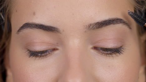 close-up beauty routine: eyebrow grooming and detailed eye view