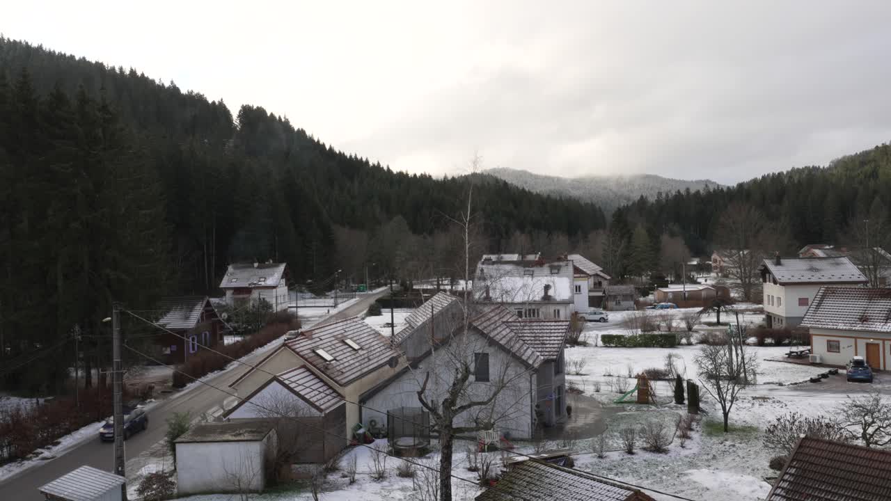 Establishing Shot Above Countryside Small Mountain Village in European Winter at G&eacute;rardmer, France