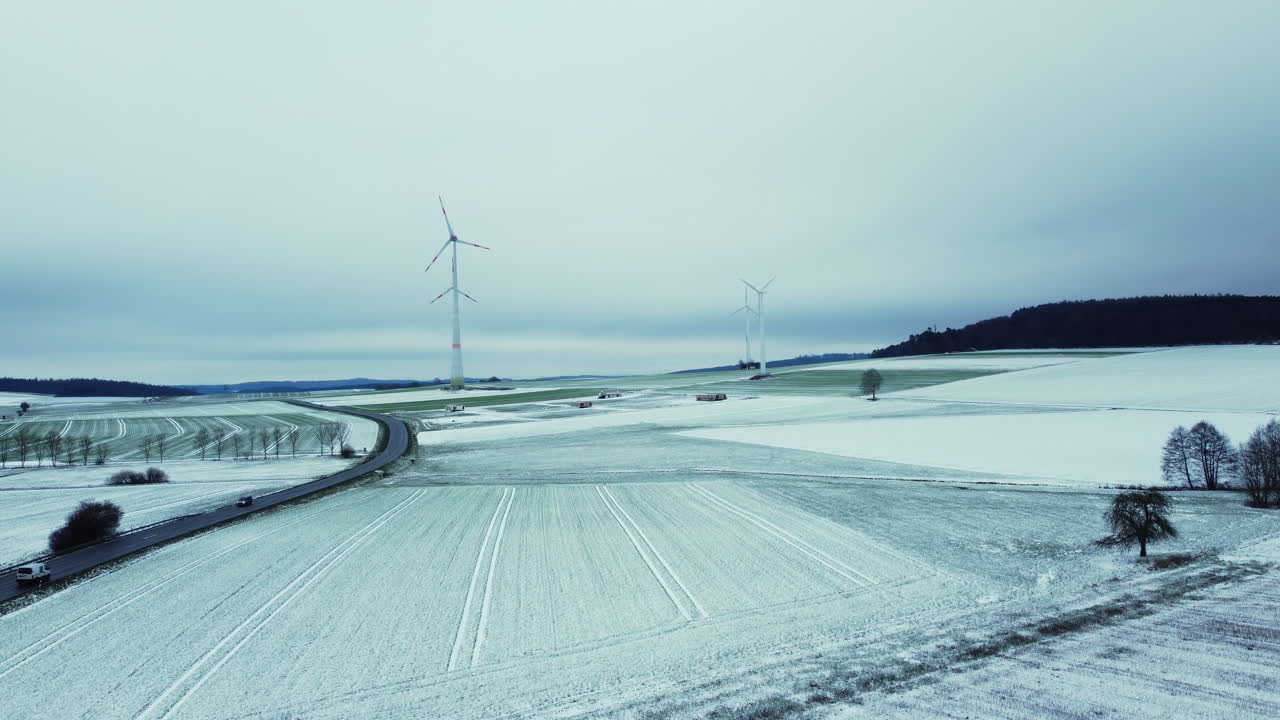 Snowy Winter Landscape with Wind Turbines