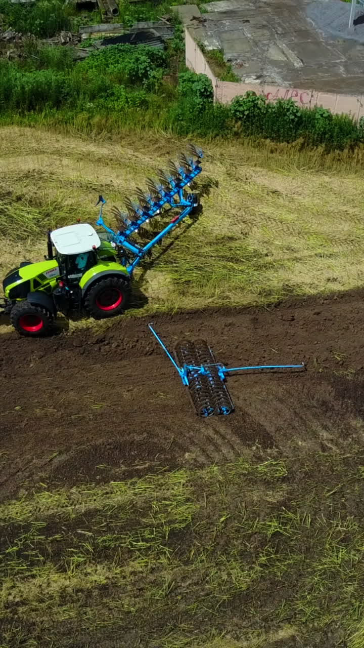 Agricultural Technique Cultivate The Land. Contemporary powerful agricultural technique allows farmers to effectively cultivate the land Vertical video