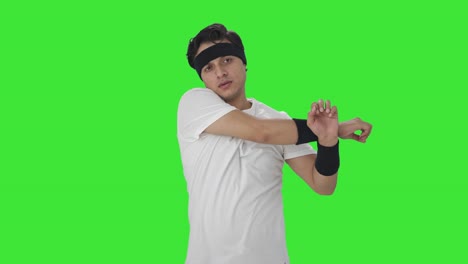 indian man doing arm exercise green screen