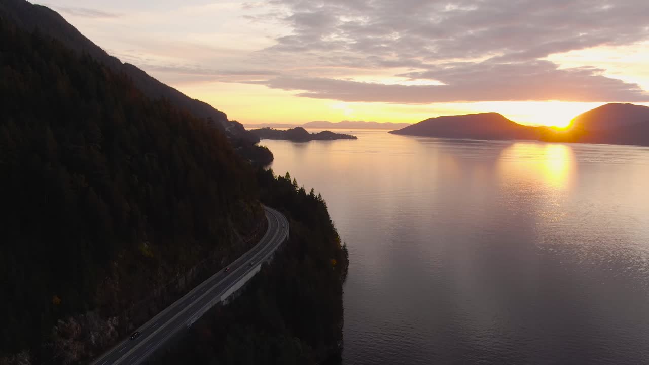 Sea to Sky Hwy in Howe Sound near Horseshoe Bay, West Vancouver, British Columbia, Canada. Aerial panoramic view during a colorful sunset in Fall Season.