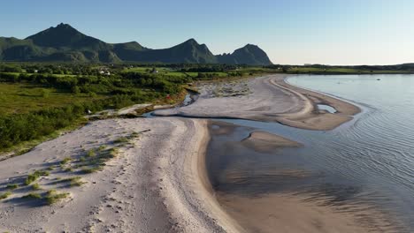 aerial footage of an incredible white sand beach on engeløya island, northern norway. during summer, it looks like a tropical paradise in the far north, bøsanden