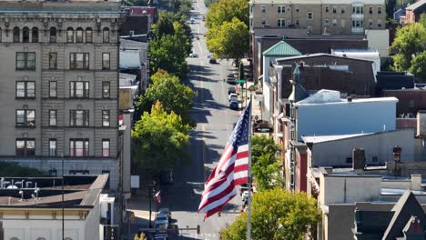 american flag in downtown american city