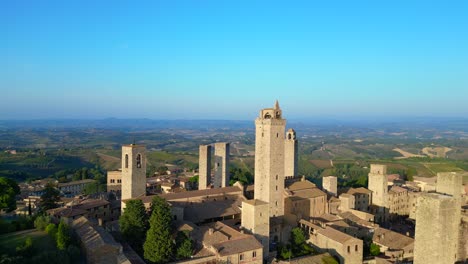 lovely aerial top view flight walled medieval hill tower town tuscany italy san gimignano