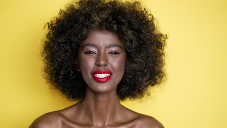 portrait of a smiling woman with curly hair