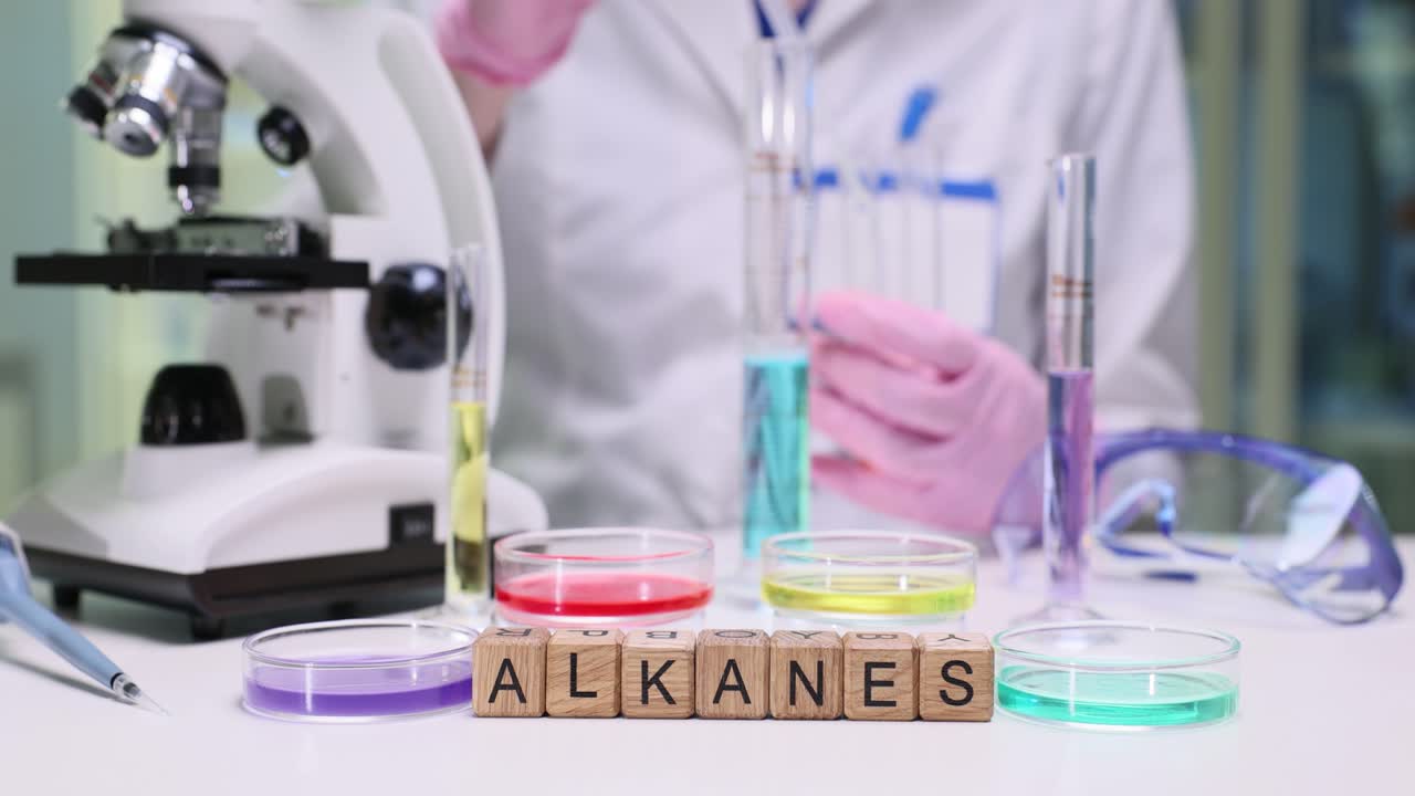 Researcher carefully adds liquid into test tubes using pipette