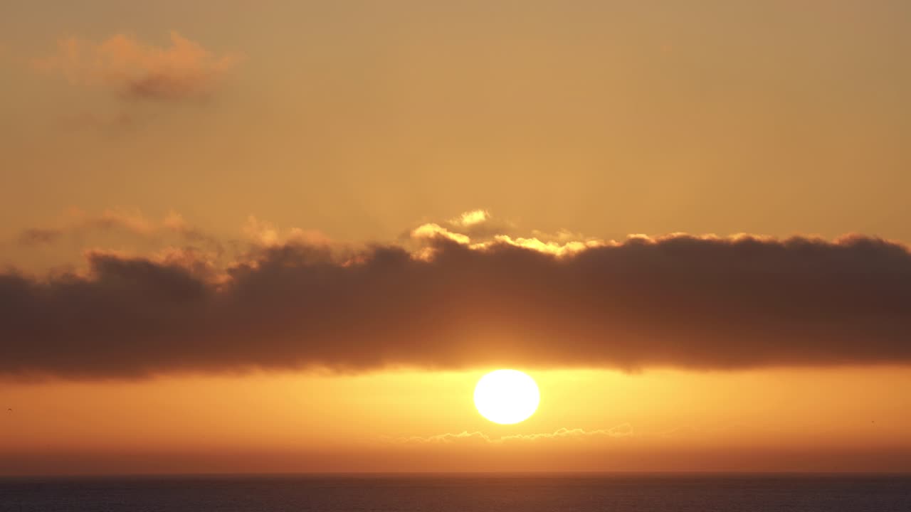Amazing and relaxing sunset from sky over sea in Cascais. Golden hour.
