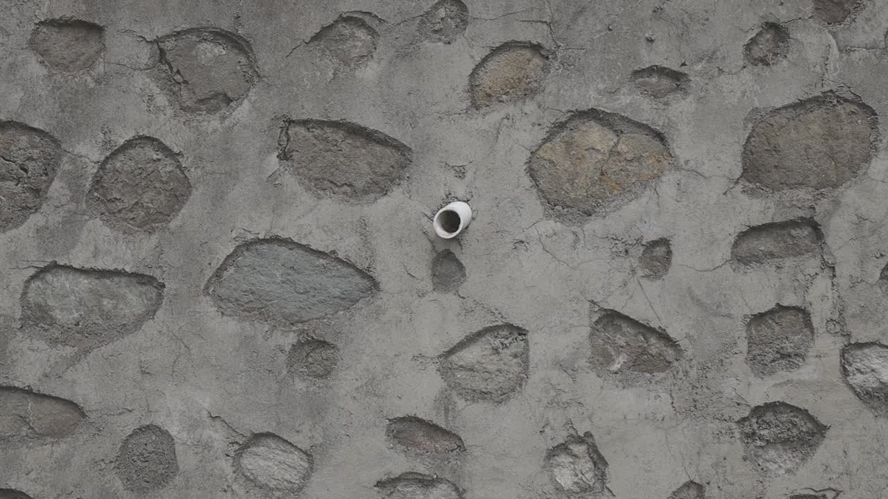 A close-up view of an exterior stone wall