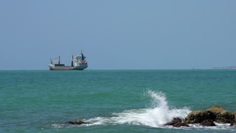 Cargo-Ship-Stopping-in-the-Middle-of-Sea-near-beach-of-Malaga