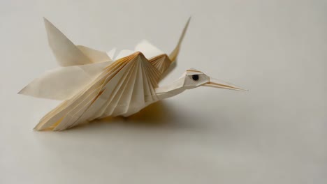 origami crane in flight