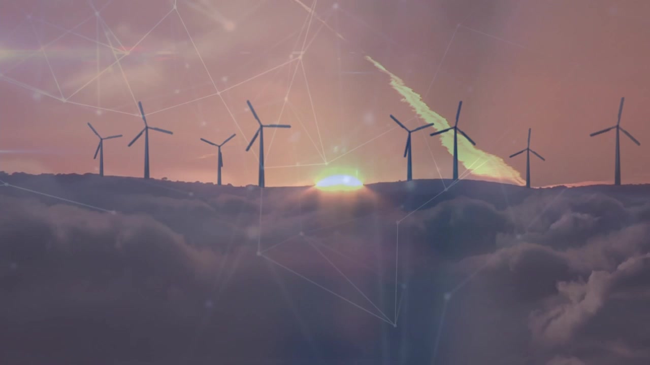 Vindmøller ved solnedgang med digitalt netværks-overlay