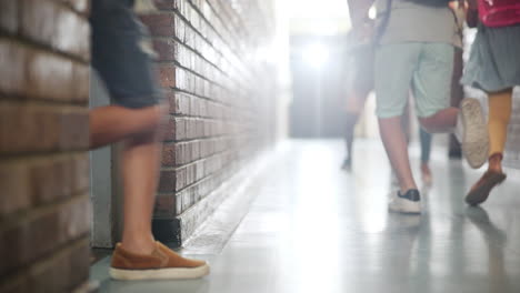 children walking in a school hallway