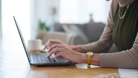 a woman working on her laptop at home