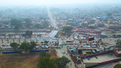 aerial view of a busy city in india with a canal