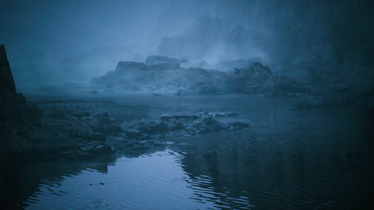Misty landscape reflecting shadows on a tranquil water surface at dawn