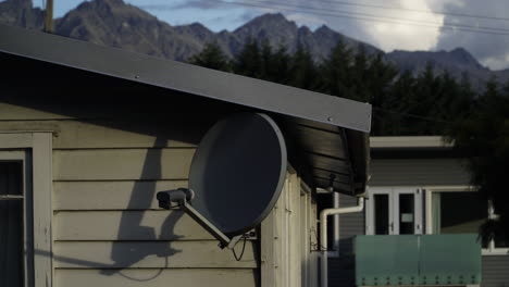 timelapse in queenstown of the analogue antenna with a background of clouds over the mountains